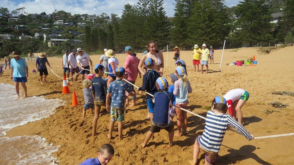 kids on the sand and in the surf